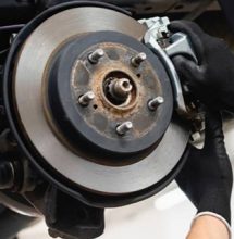 An exposed car brake being repaired at a shop for auto repair in Safety Harbor for auto services