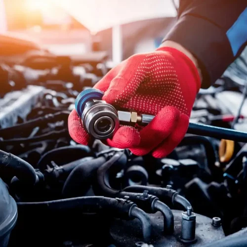 ac-repair-1920w Red-gloved hands tending to air conditioning repair in Gaithersburg