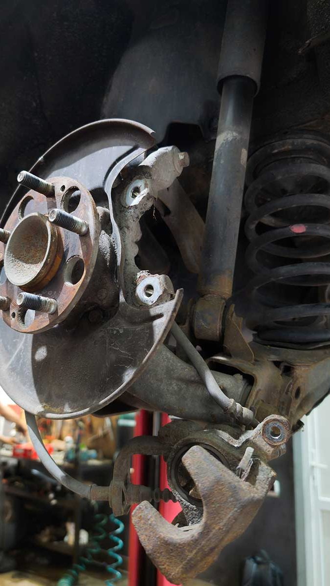An exposed car brake being repaired at a shop for auto repair in Gaithersbur for brake service in Gaithersburg